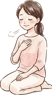 ママが胸に手を当てて目を閉じ、ゆっくり深呼吸している