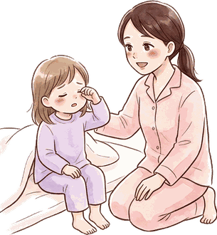 夜中に目をこすって起き上がった上の子の肩に、ママがそっと手を添えている